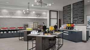 Una cocina moderna con una isla central, taburetes de bar y una estación de café.