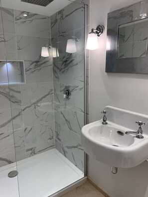 Shower, eco-friendly toiletries, hair dryer, towels