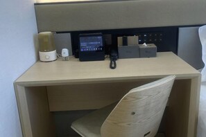 A hotel desk with a coffee maker, a digital device, and a tissue box. - Wei Hotel Fan (Beijing Wangjing SOHO Yitong Subway Station) (Beijing)