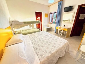 A room with bunk beds, a desk, a chair, a television, and a window with curtains. - Villa Mena (Forio)