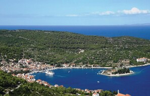 Experience the charm of a traditional coastal town, nestled between green hills and the sea, with a picturesque marina offering easy access to the waterfront.