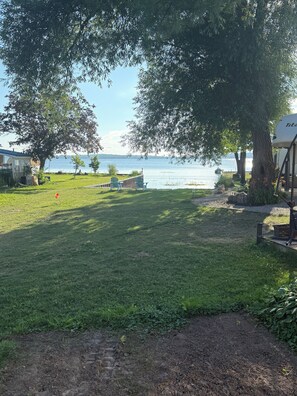 Property grounds - Waterview Trailer on Georgian Bay w/ kayaks and paddleboard and sandy beach (Victoria Harbour)