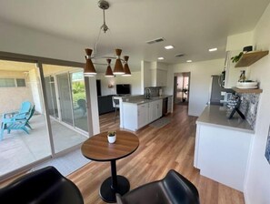 Enjoy meals in the kitchen with an oven, microwave, and wine cooler, and dine at the round table with an island.