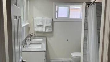 Jetted tub, hair dryer, towels, soap