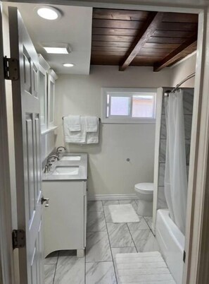 Jetted tub, hair dryer, towels, soap