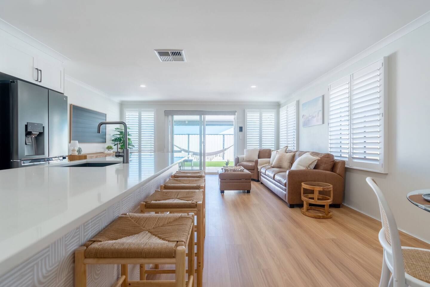 Open-plan kitchen, dining, and living area