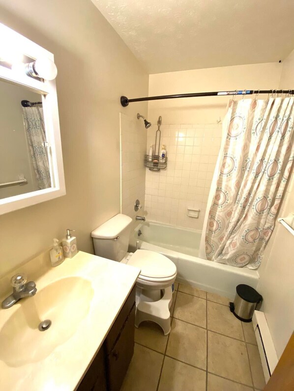 A bathroom with a toilet, sink, shower, and bathtub. - 2mins from Miami U, Cozy duplex home (Oxford)