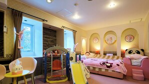 A children's room with a play area, including a slide and a small table. - Ikaho no mori Kids Paradise (Yoshioka)