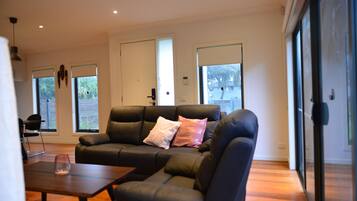 Basic Townhome | Living area | 65-inch LED TV with digital channels, TV, Netflix