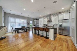 Enjoy meals in this well-equipped kitchen with a central island and adjacent dining area.