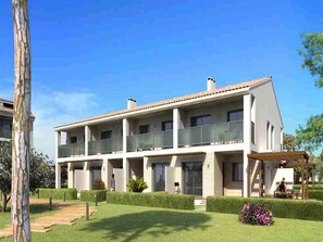 A modern two-story residential building with a flat roof, large windows, and a covered outdoor seating area. - Resort Home 10 (castellon)