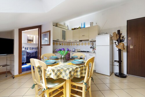 Holiday Apartment "Mansarda Di Ponente" near Beach with Shared Garden & A/C