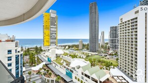 A modern hotel complex with multiple high-rise buildings, a beachfront view, and a well-maintained outdoor area with pathways and greenery. - The Wave - 3 Bedroom Broadbeach Apartment (Broadbeach)