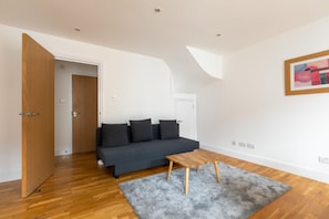 Basic Apartment, Multiple Beds | Living area