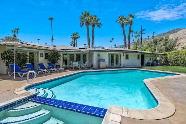 Private rear yard with pool/spa, grill, and mountain views