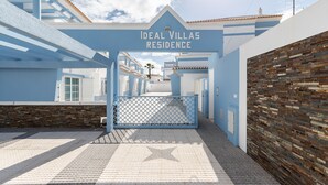 A gated entrance to a residential area with a sign reading "Ideal Villas Residence". - 4 bedroom villa in condominium with swimming pool by AlgarveManta (9V4) (Manta Rota)