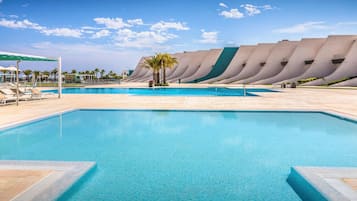 Seasonal outdoor pool, open 10:30 AM to 8:30 PM, pool umbrellas