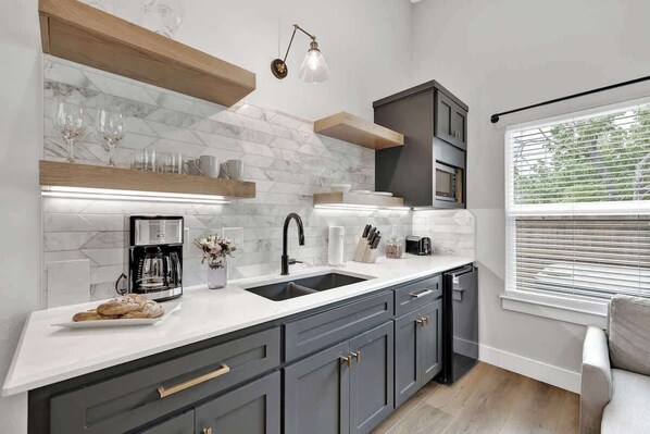 Fridge, microwave, coffee/tea maker, toaster