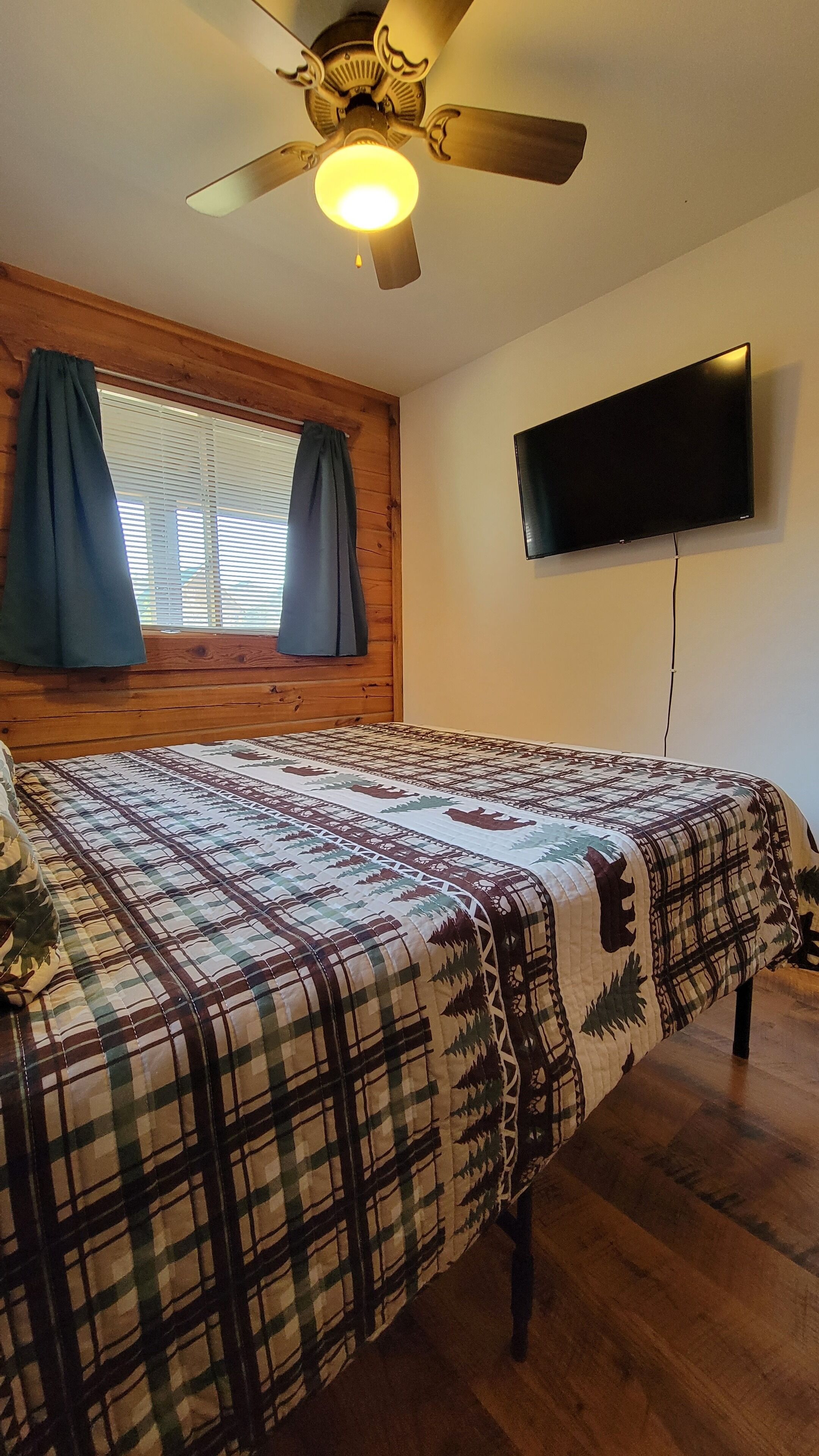 The Grizzly Den is a 3 bed 2 bath cabin with a Wii and Golf Cart!