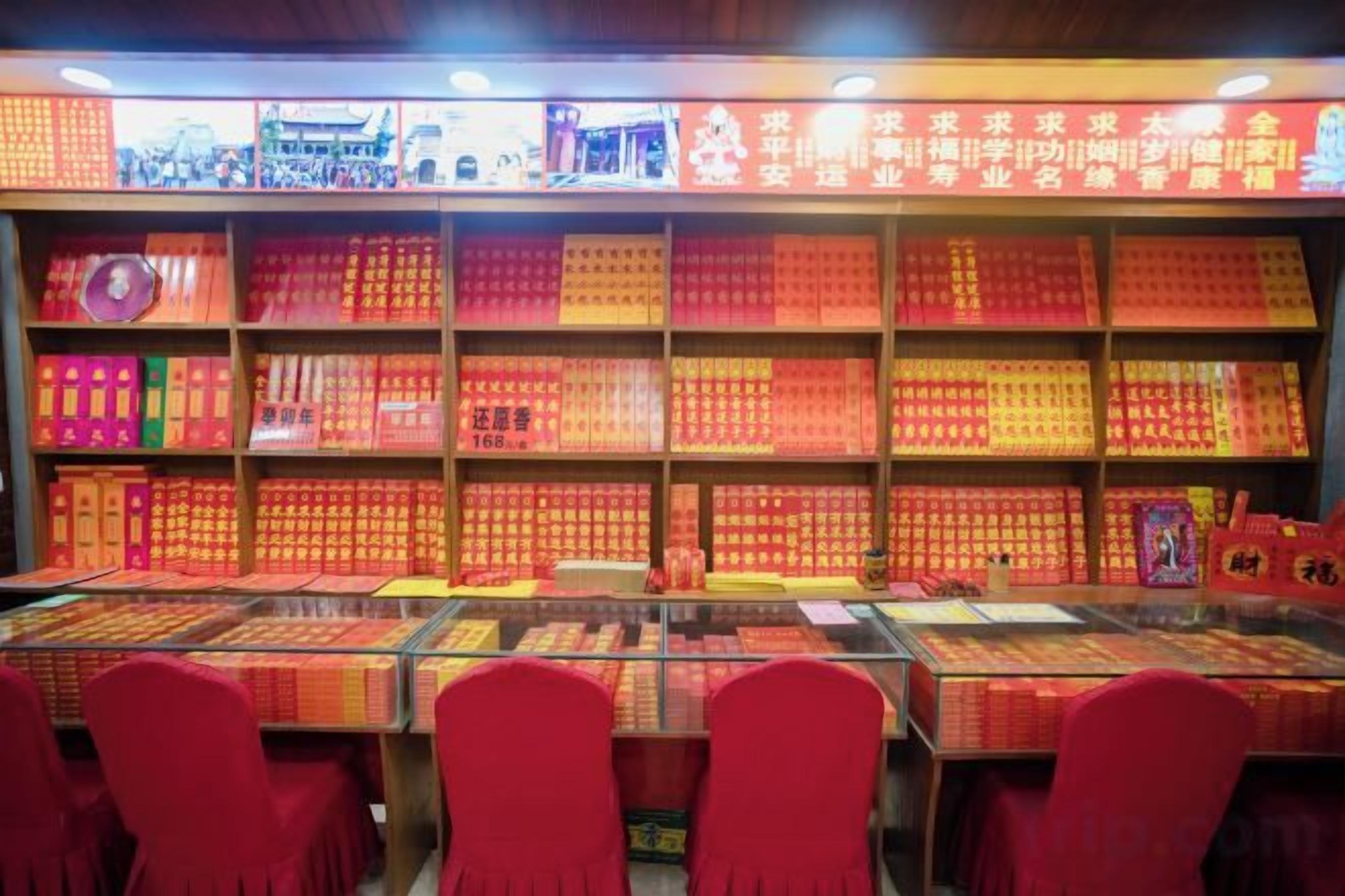 A bookstore with shelves of books and a glass display case in the foreground.