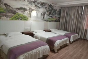 A hotel room with three beds, a mural of a waterfall, and a curtain. - Hengyang Wangyuelou Homestay (Mount Heng Scenic Area Nanyue Grand Temple) (Hengyang)