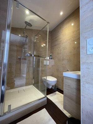 Shower, hair dryer, towels, soap