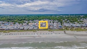 A coastal residential area with houses and a beach. - Sea Breeze Retreat with Gorgeous Ocean Views! (Myrtle Beach)