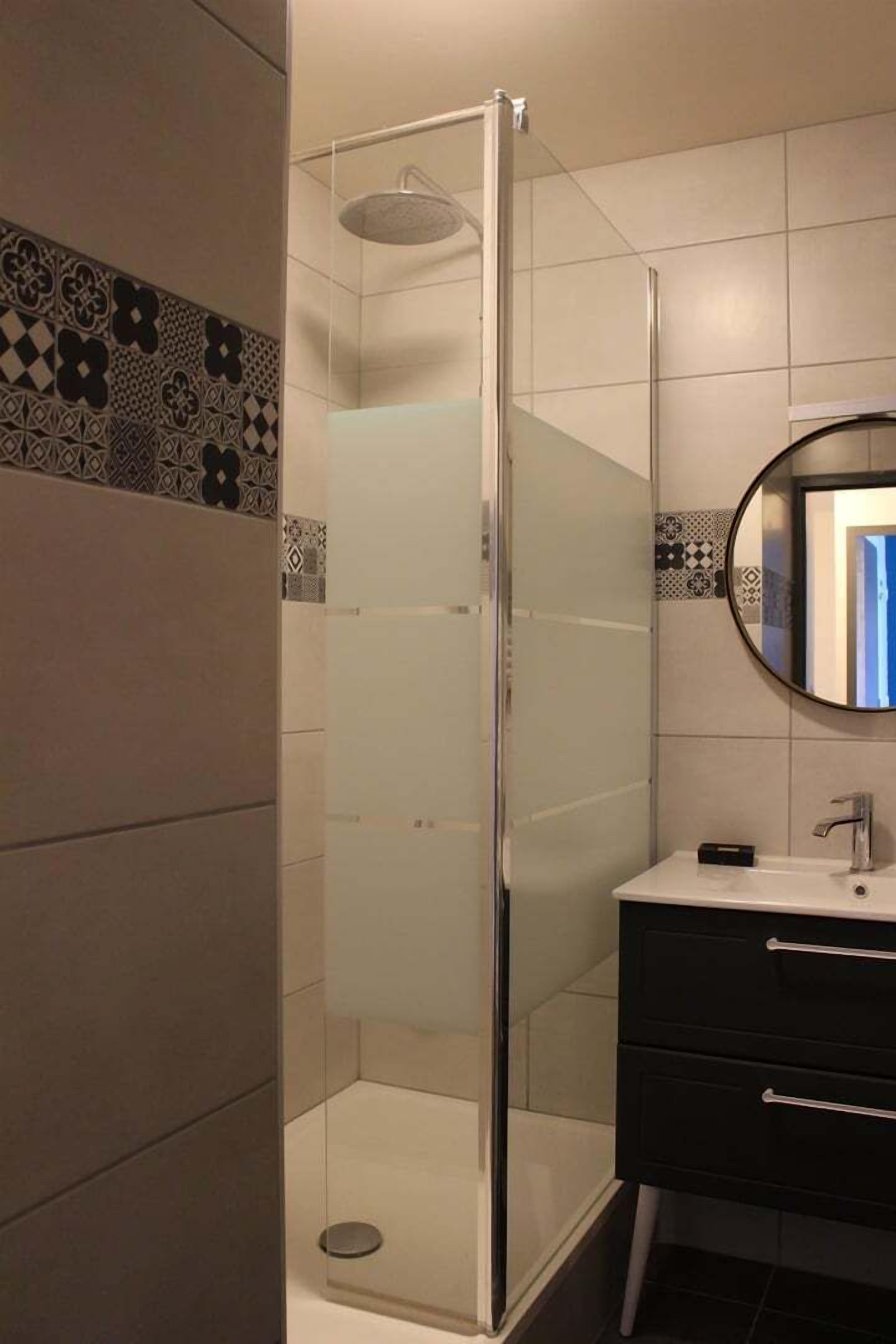 Shower, hair dryer, towels, toilet paper