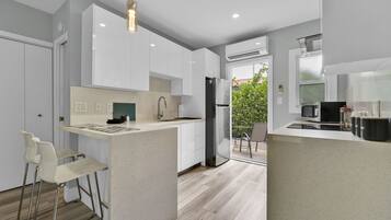 Fridge, microwave, stovetop, coffee/tea maker