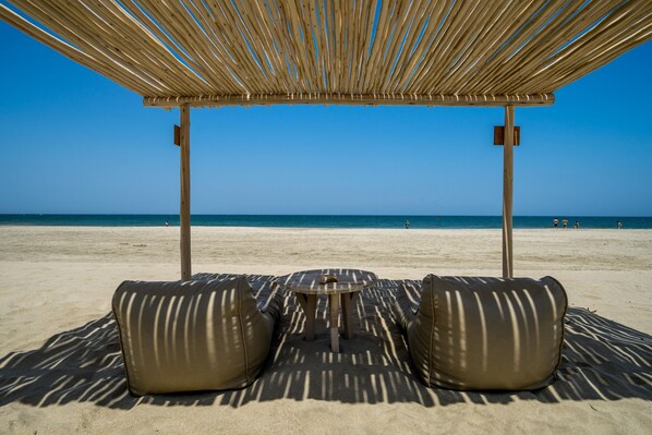 Private beach, white sand, beach umbrellas, beach towels