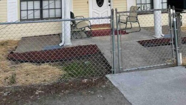 A two-story house with a front porch, a mailbox, and a fence. - Cozy 3BR home close to trails. (Logan)