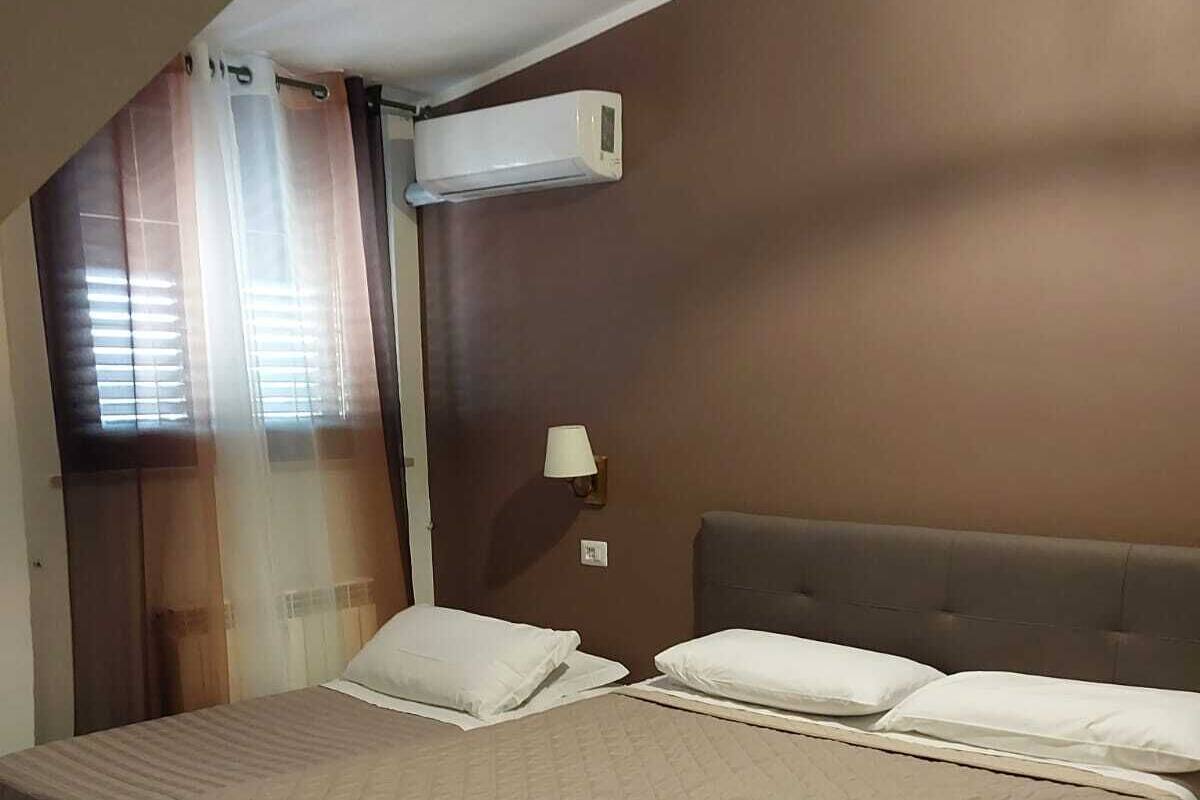Chambre triple Deluxe | Système d’insonorisation, fer et planche à repasser