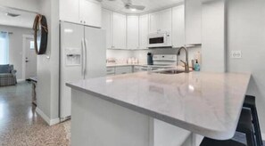 Fridge, stovetop, cookware/dishes/utensils