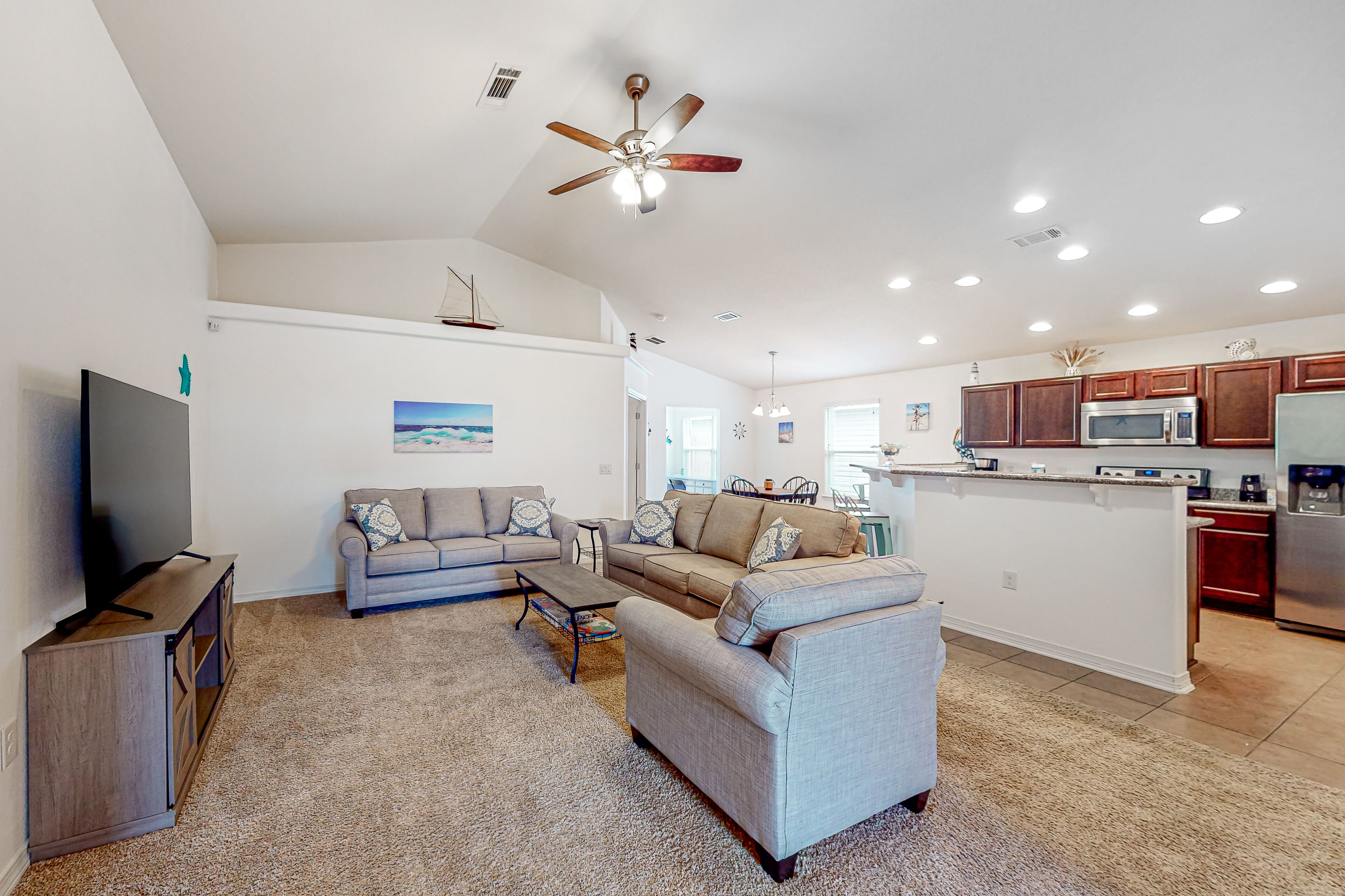 Dog-friendly home with enclosed yard, covered patio, central AC, & W/D