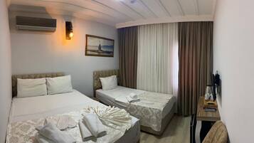 Quarto triplo conforto | Roupas de cama premium