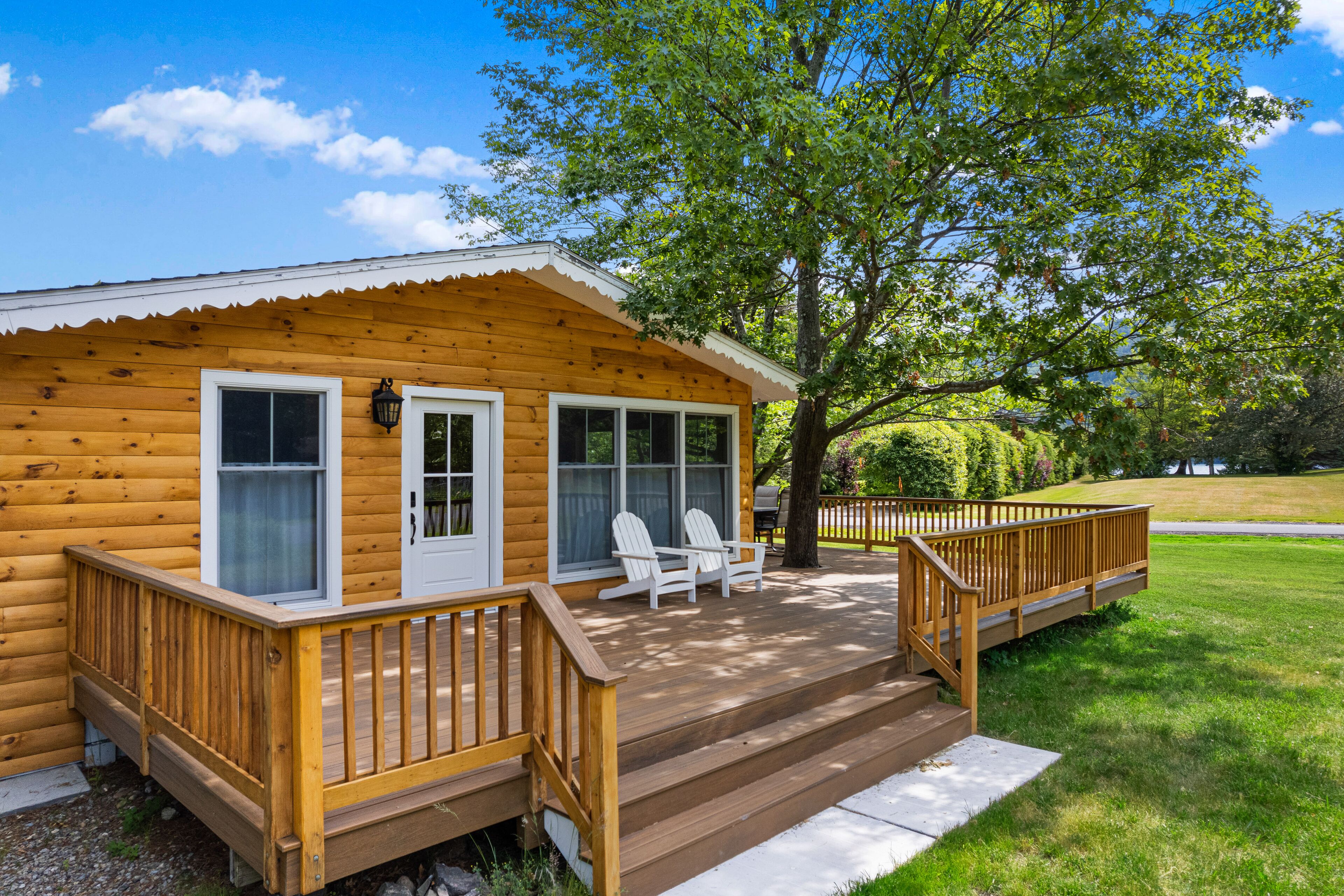 Lake-view home with large deck, grill, lawn, & mtn views - dog-friendly