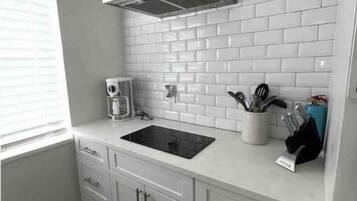 Fridge, microwave, stovetop, coffee/tea maker
