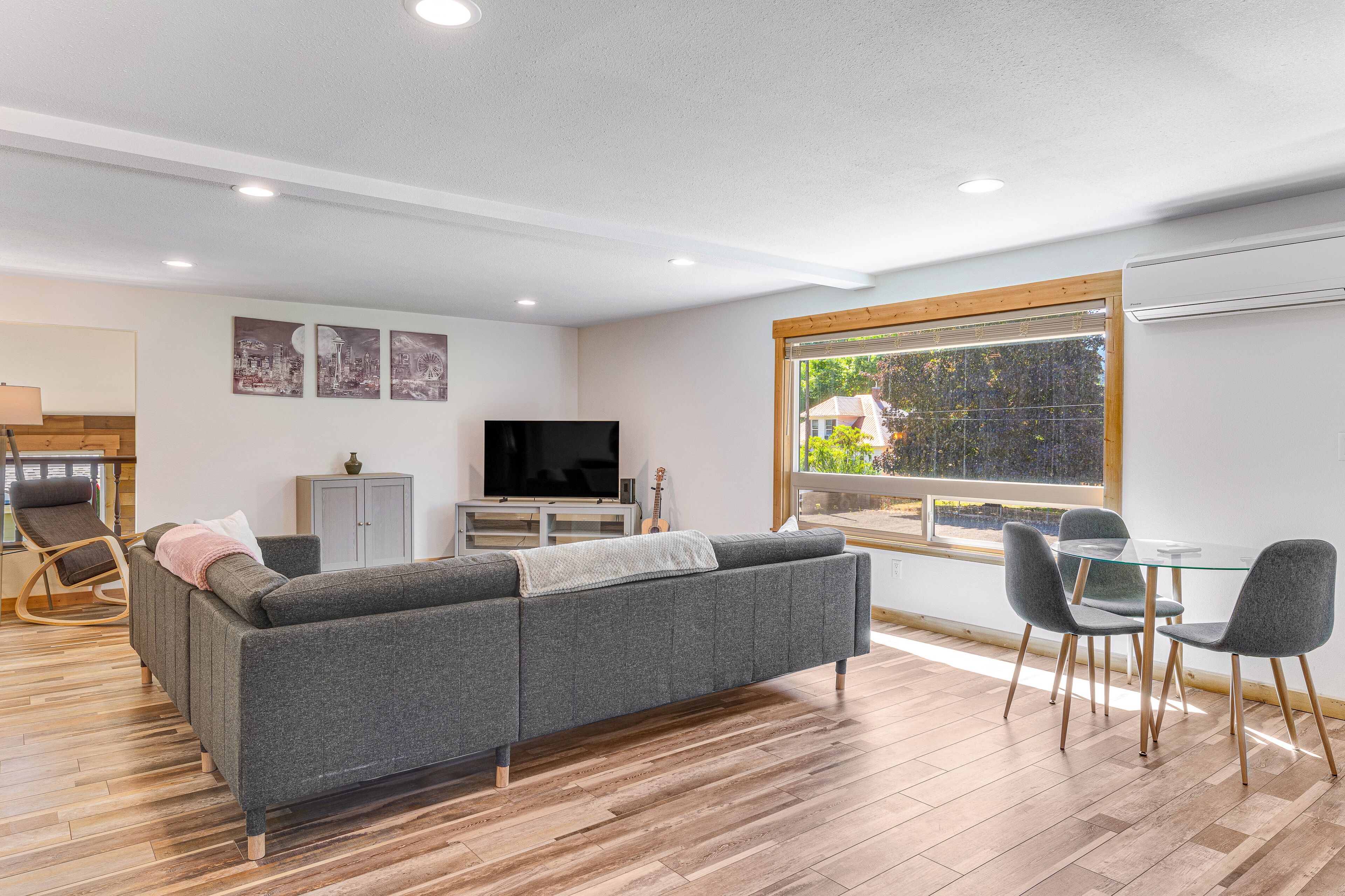 Two-story home near downtown with large deck, lawn, washer/dryer, enclosed yard