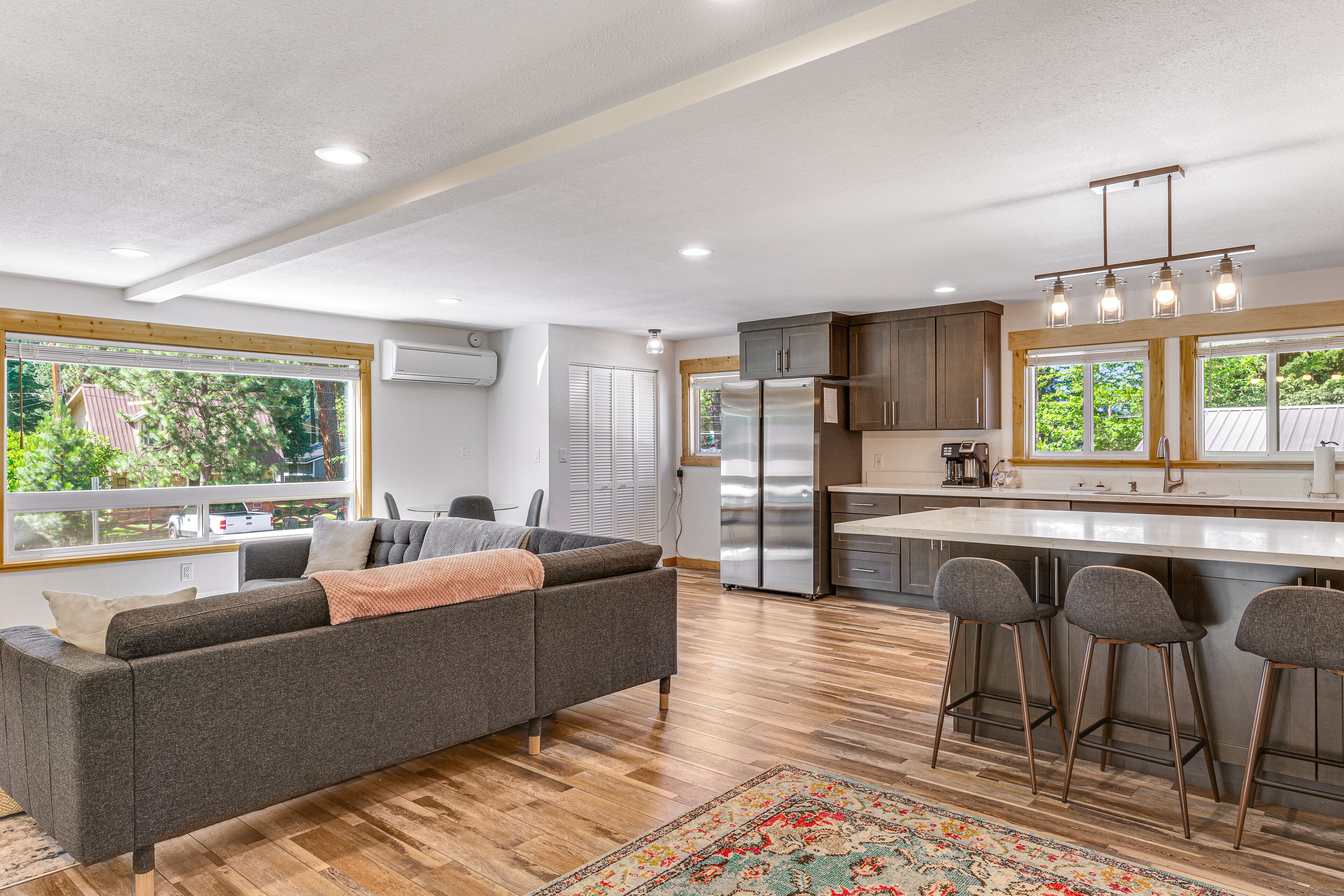 Two-story home near downtown with large deck, lawn, washer/dryer, enclosed yard