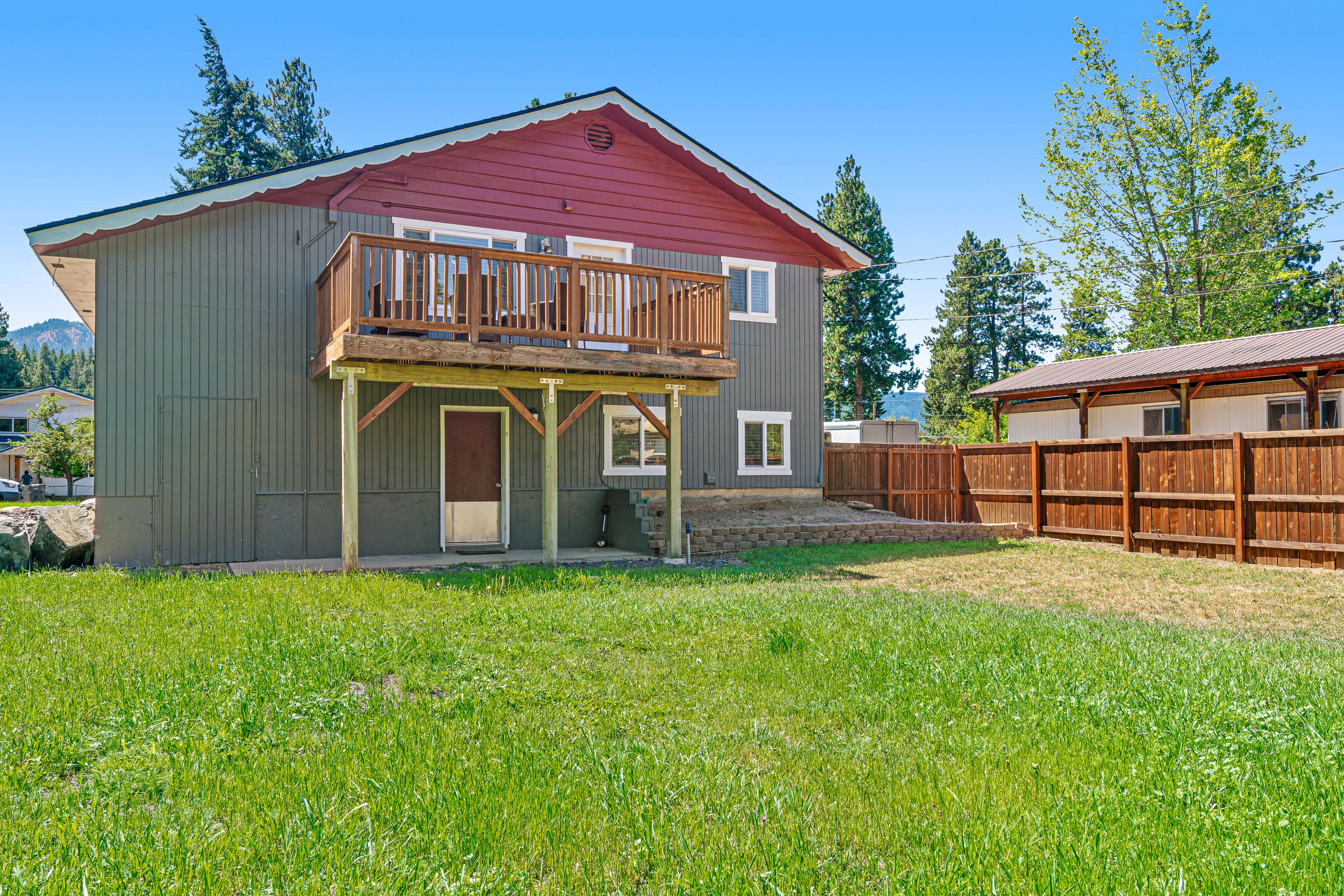 Two-story home near downtown with large deck, lawn, washer/dryer, enclosed yard