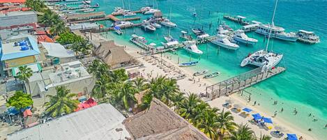 On the beach, sun loungers, beach towels