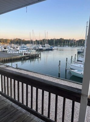 Enjoy waterfront views from a sheltered vantage point overlooking the marina and its tranquil surroundings.