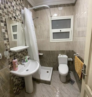 Comfort Apartment, 2 Bedrooms, Garden View | Bathroom | Slippers - Your Comfortable Home (New Cairo)