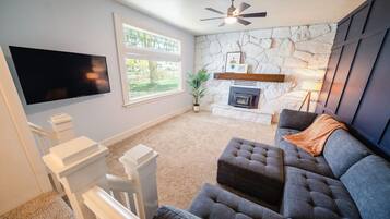 Smart TV, fireplace, books, music library