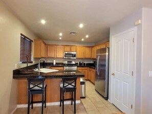 Coffee/tea maker, fridge, microwave, oven