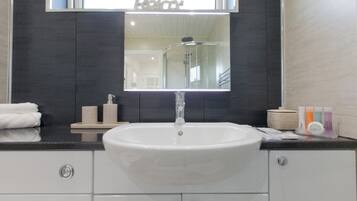 Shower, hair dryer, towels, soap