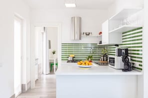 Fridge, microwave, stovetop, coffee/tea maker