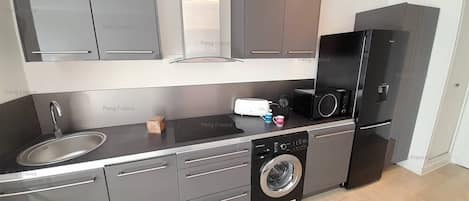 Fridge, microwave, dishwasher, cookware/dishes/utensils