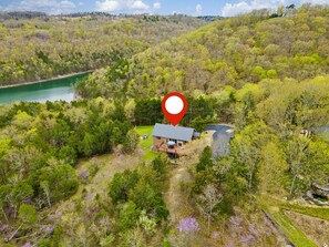 Escape to a serene retreat surrounded by lush greenery and a tranquil pond.