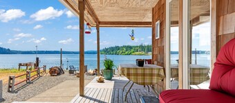 Waterfront, cabin- style home with breathtaking views of Skookum Inlet.